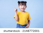Image of Asian child posing on blue background